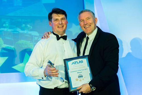 Paul Nellis of Orangery Solutions collecting the award from Gareth Thomas Paul Nellis of Orangery Solutions collecting the award from Gareth Thomas