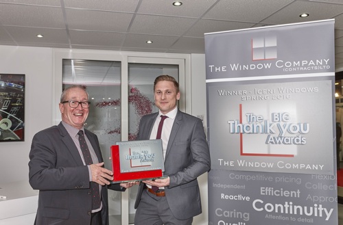 David Thornton (left) from The Window Company presenting the Big Thank You award to Paul Foyle from Iceni on the REHAU stand at FIT