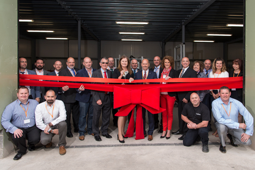 Emma Leeke (MD) cuts the ribbon on the official open day, surrounded by members of the Modplan, Leekes and Veka teams.