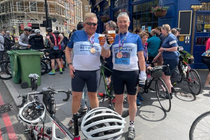 EU81 Euroglaze's Martin Nettleton (left) and guide Andrew Oates pictured at the end of the Ride 100 charity